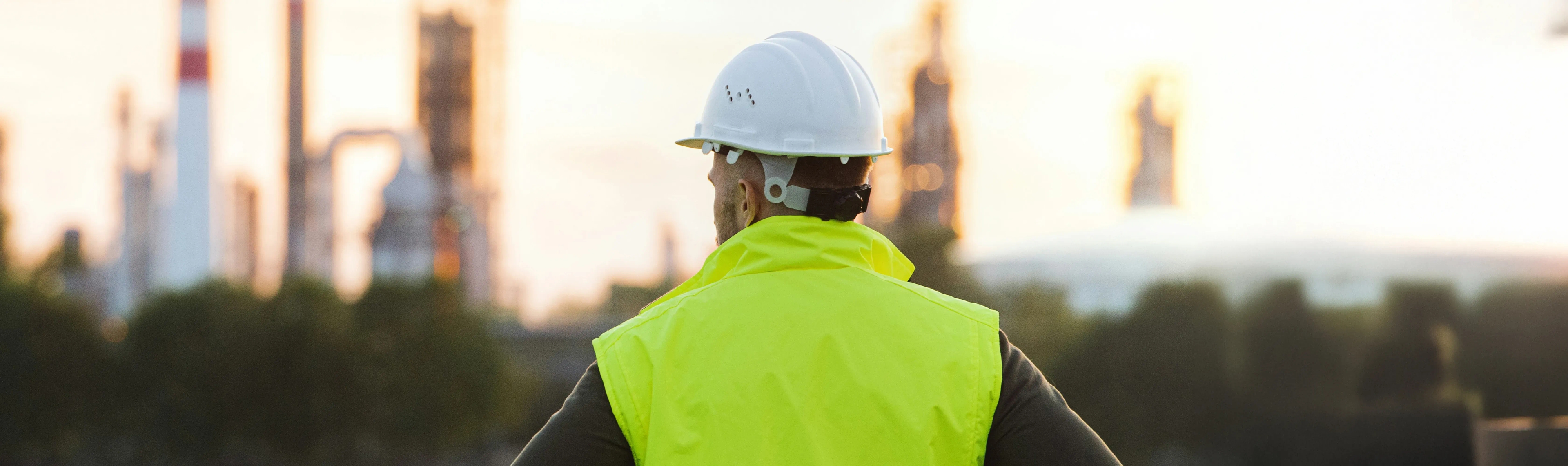 Man looking over construction plant from a distance